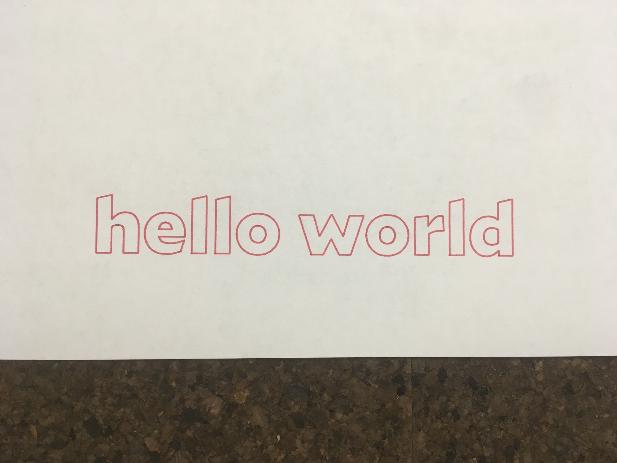 A plotted printing that reads 'hello world'